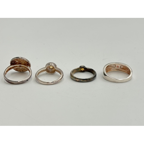 2250 - Four .925 silver gemstone set dress rings to include mother of pearl, citrine etc. - approx. gross w... 