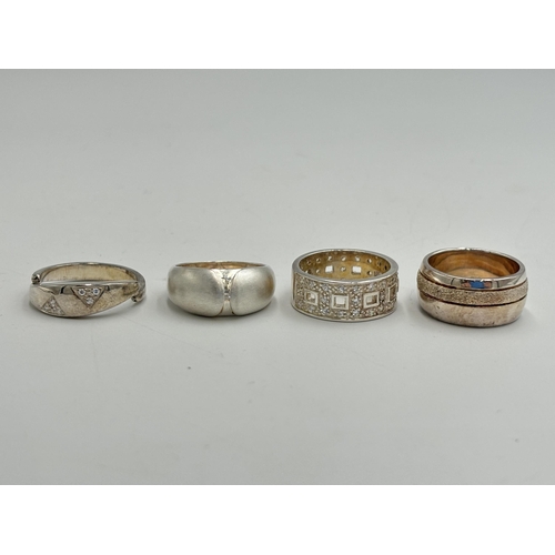 2254 - Four .925 silver CZ set dress rings - approx. gross weight 24g