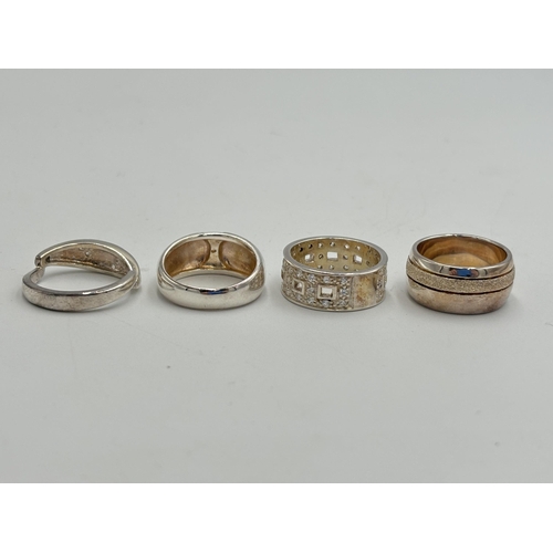 2254 - Four .925 silver CZ set dress rings - approx. gross weight 24g