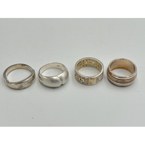 2254 - Four .925 silver CZ set dress rings - approx. gross weight 24g