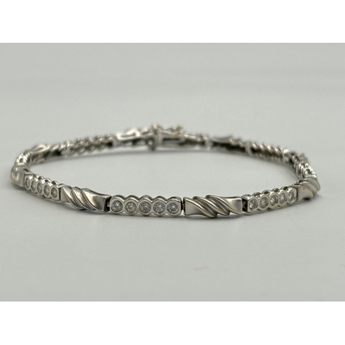 2259A - A hallmarked 18ct white gold diamond set bracelet - approx. gross weight 9.9g and 18cm long