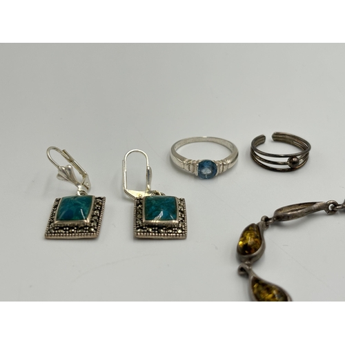 2259H - A collection of .925 silver jewellery to include amber set panel bracelet etc.