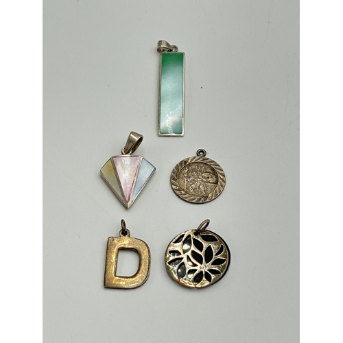 2259I - Five .925 silver pendants to include mother of pearl, St. Christopher etc. - approx. gross weight 19... 