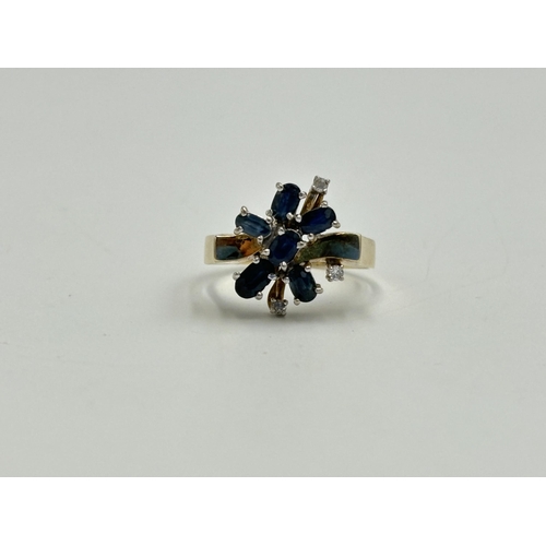 2259T - A 14ct gold sapphire and diamond cluster ring, size O - approx. gross weight 3.8g