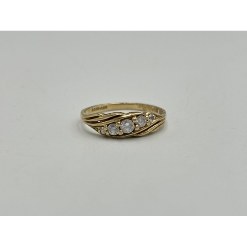 2259X - A hallmarked London 9ct gold CZ five stone ring, size O - approx. gross weight 1.7g