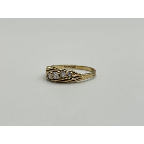 2259X - A hallmarked London 9ct gold CZ five stone ring, size O - approx. gross weight 1.7g