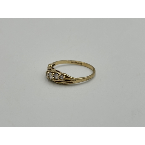 2259X - A hallmarked London 9ct gold CZ five stone ring, size O - approx. gross weight 1.7g