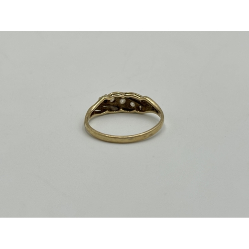 2259X - A hallmarked London 9ct gold CZ five stone ring, size O - approx. gross weight 1.7g