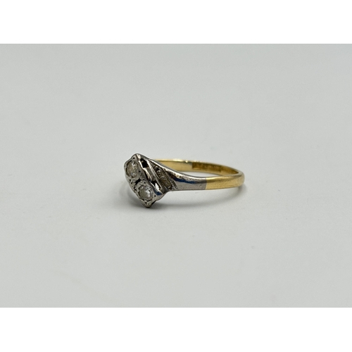 2259Y - An 18ct gold and platinum diamond two stone ring, size O - approx. gross weight 2.5g