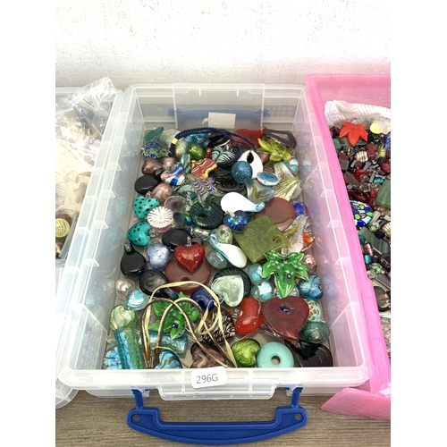 487 - Four boxes containing a large collection of glass pendants, charms and beads