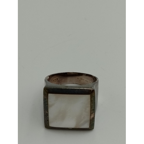 2257 - Four .925 silver gemstone set cocktail rings to include mother of pearl, tiger's eye etc. - approx. ... 