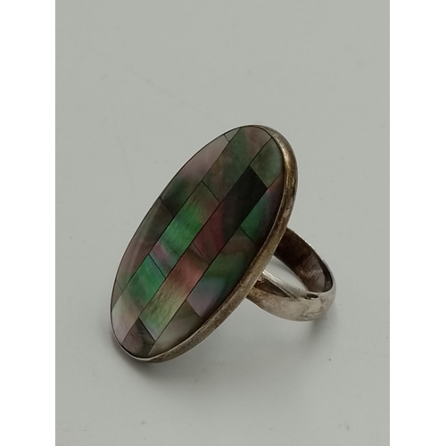 2257 - Four .925 silver gemstone set cocktail rings to include mother of pearl, tiger's eye etc. - approx. ... 