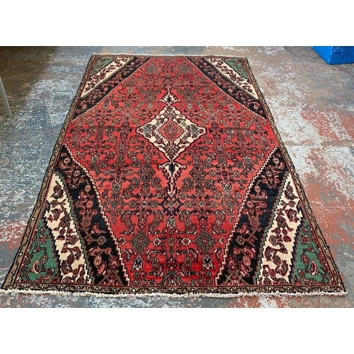 5 - A Persian Hamedan hand knotted 100% wool rug - approx. 267cm x 173cm