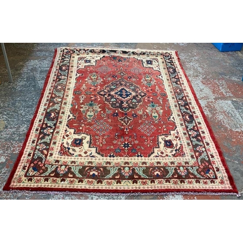 6 - A 20th century Iranian hand knotted rug - approx. 270cm x 186cm