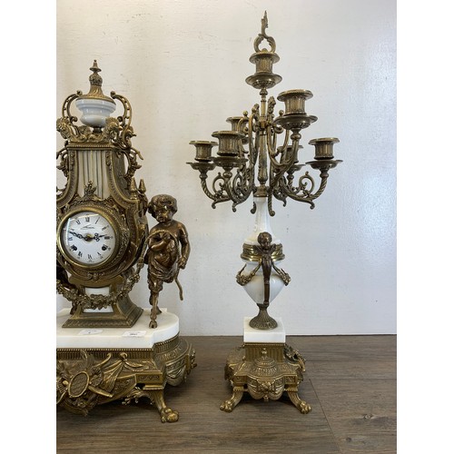 2 - A 20th century Italian Brevettato brass and white marble mantel clock and garniture set with cherub ... 