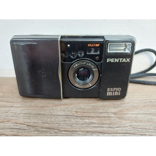 740 - A cased Pentax Espio Mini autofocus compact 35mm camera fitted with wide-angle prime lens with remot... 