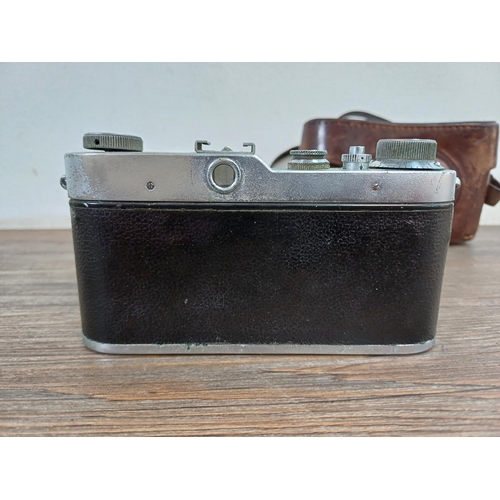 741 - A cased 1950s Meopta Opema II coupled rangefinder 35mm camera fitted with Belar 45/3.5 collapsible l... 