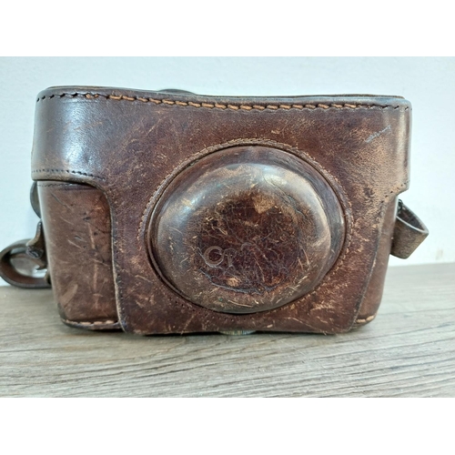 741 - A cased 1950s Meopta Opema II coupled rangefinder 35mm camera fitted with Belar 45/3.5 collapsible l... 