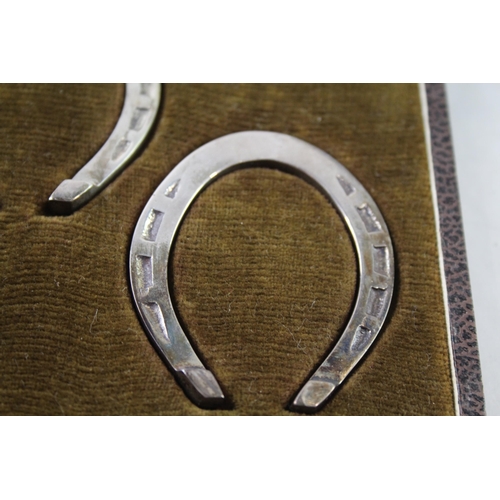 2378 - A boxed set of two hallmarked sterling silver lucky horse shoe serviette rings - approx. gross weigh... 