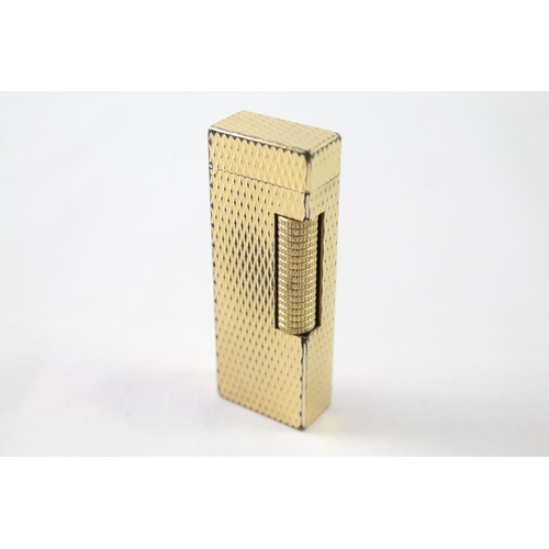 2395 - A vintage Dunhill Rollagas gold tone diamond texture cigarette lighter