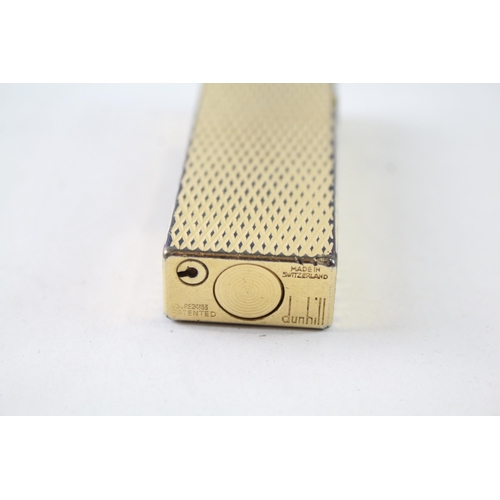 2395 - A vintage Dunhill Rollagas gold tone diamond texture cigarette lighter