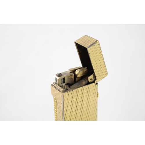 2396 - A vintage Dunhill Rollagas gold tone diamond texture cigarette lighter