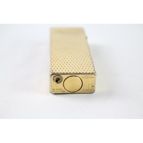 2396 - A vintage Dunhill Rollagas gold tone diamond texture cigarette lighter