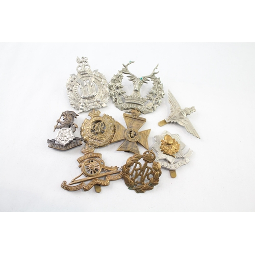 2402 - Nine military cap badges