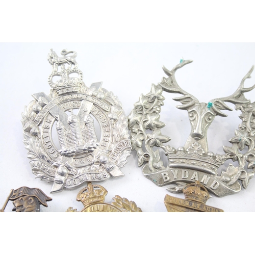 2402 - Nine military cap badges