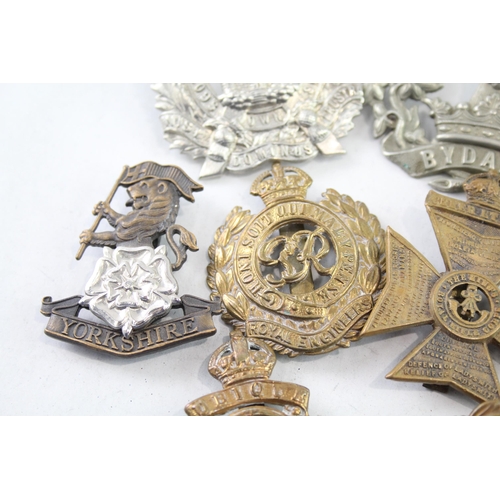 2402 - Nine military cap badges