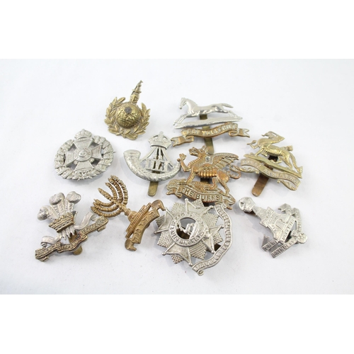 2403 - Ten military cap badges