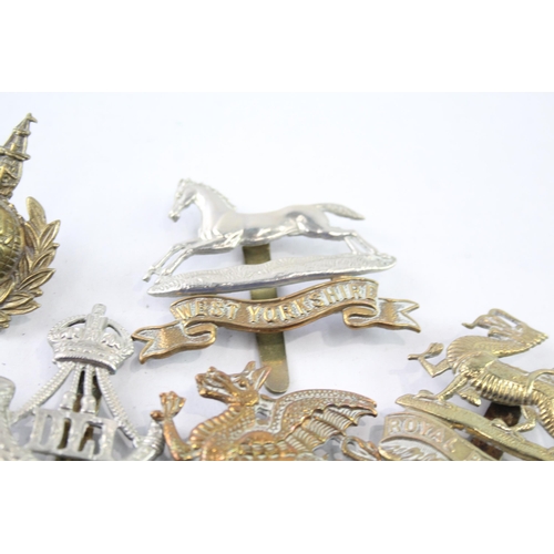 2403 - Ten military cap badges