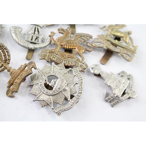 2403 - Ten military cap badges