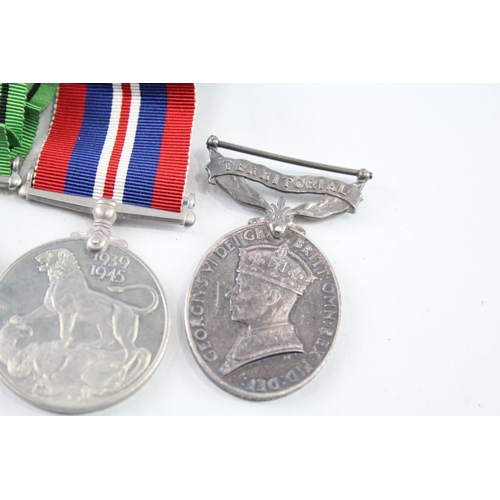 2410 - A WWII medal group to include Territorial medal presented to Pte. Berwick