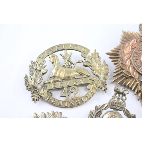 2411 - Ten military cap badges