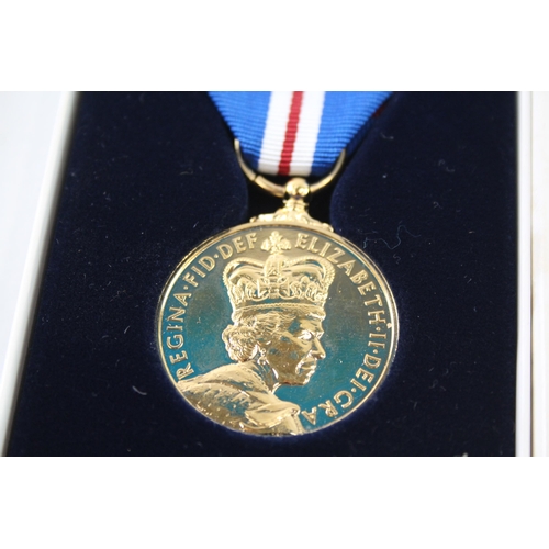 2413 - A boxed Elizabeth II The Queen's Golden Jubilee medal with certificate of authenticity