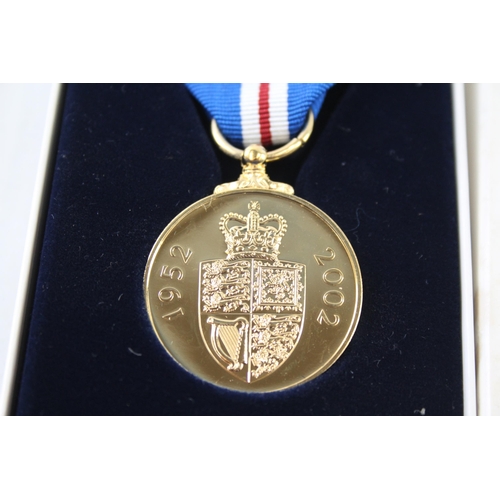 2413 - A boxed Elizabeth II The Queen's Golden Jubilee medal with certificate of authenticity