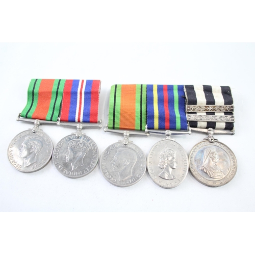 2423 - Two mounted medal groups, one comprising Order of St. John Long Service, Civil Defence Service and T... 