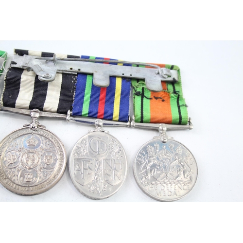 2423 - Two mounted medal groups, one comprising Order of St. John Long Service, Civil Defence Service and T... 