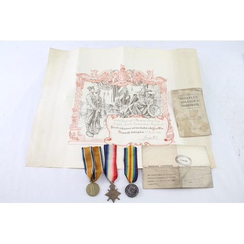 2427 - A WWI British medal trio with original discharge papers presented to 3133 Cpl. Hanley L.N. Lancs