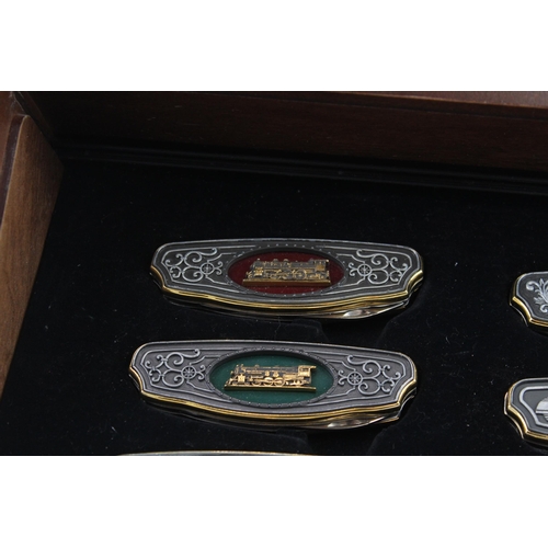 562 - A Franklin Mint Railroad collector's folding knife set