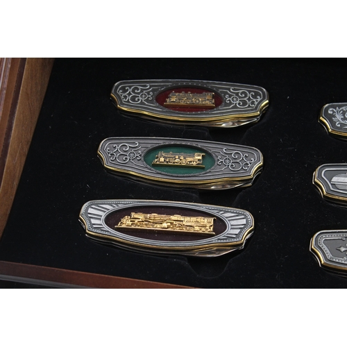 562 - A Franklin Mint Railroad collector's folding knife set