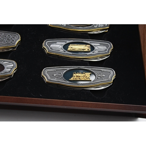 562 - A Franklin Mint Railroad collector's folding knife set