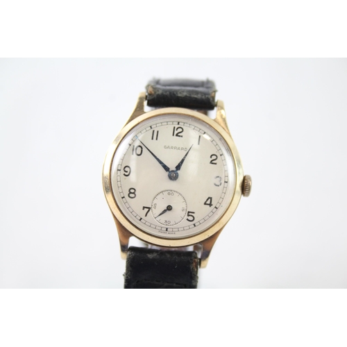 A vintage Garrard 9ct gold cased hand wind presentation wristwatch