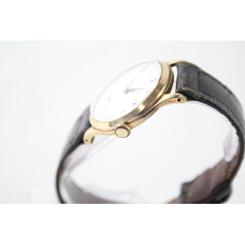 A vintage Garrard 9ct gold cased hand wind presentation wristwatch