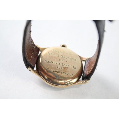 A vintage Garrard 9ct gold cased hand wind presentation wristwatch