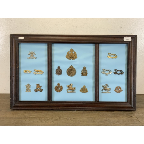 2429 - Seventeen framed Yeomanry military cap badges