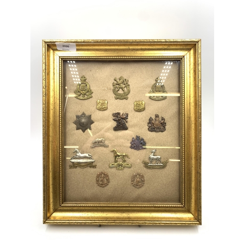 2430 - Fifteen framed military cap badges