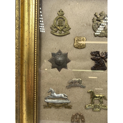 2430 - Fifteen framed military cap badges