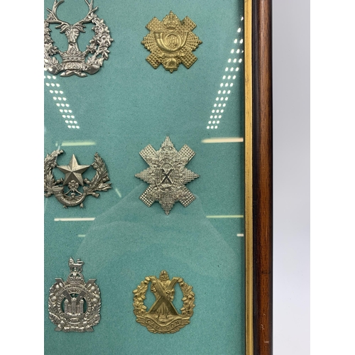 2431 - Nine framed military cap badges